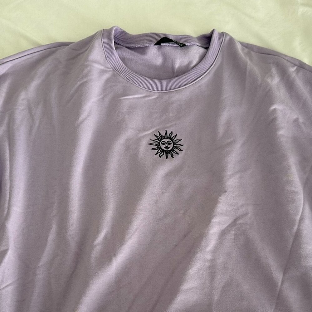 Lilac Purple Crewneck with Small Sun Design